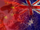 China's and Australia's flags in the foreground. In the background is a man harvesting Australia's number one wine grape, the Australian Shiraz (Photo by: Wine Australia)