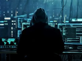 Cyber attack concept photo. Hacker in a hoodie sitting in front of multiples monitors. Photo by laddlajutt1722 from pixabay via Canva Pro / NHA File Photo