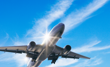 Photo for illustrative purposes only. Aircraft flying mid air against blue sky and strips of white clouds. | Photo by gyro / Getty Images (via Canva Pro) / NHA File Photo